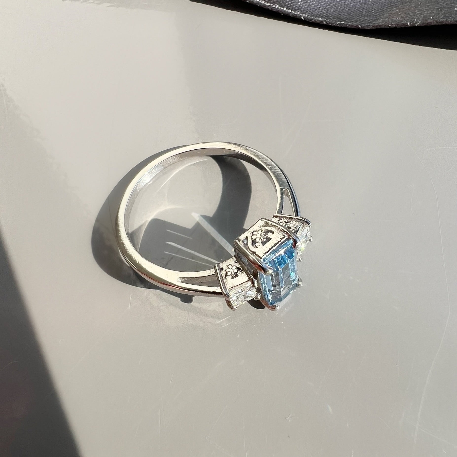 0.80ct Aquamarine and 0.26ct Princess Cut Diamond 3 Stone Ring