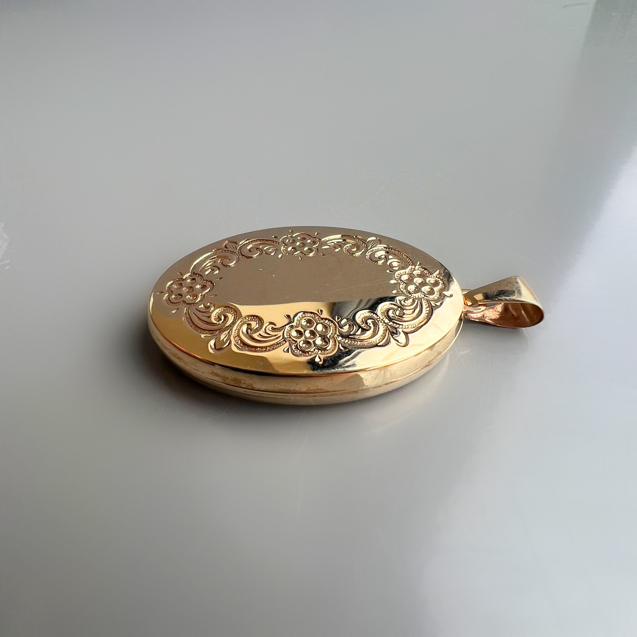 Vintage 9ct Gold Oval Shaped Locket with Floral Engraving