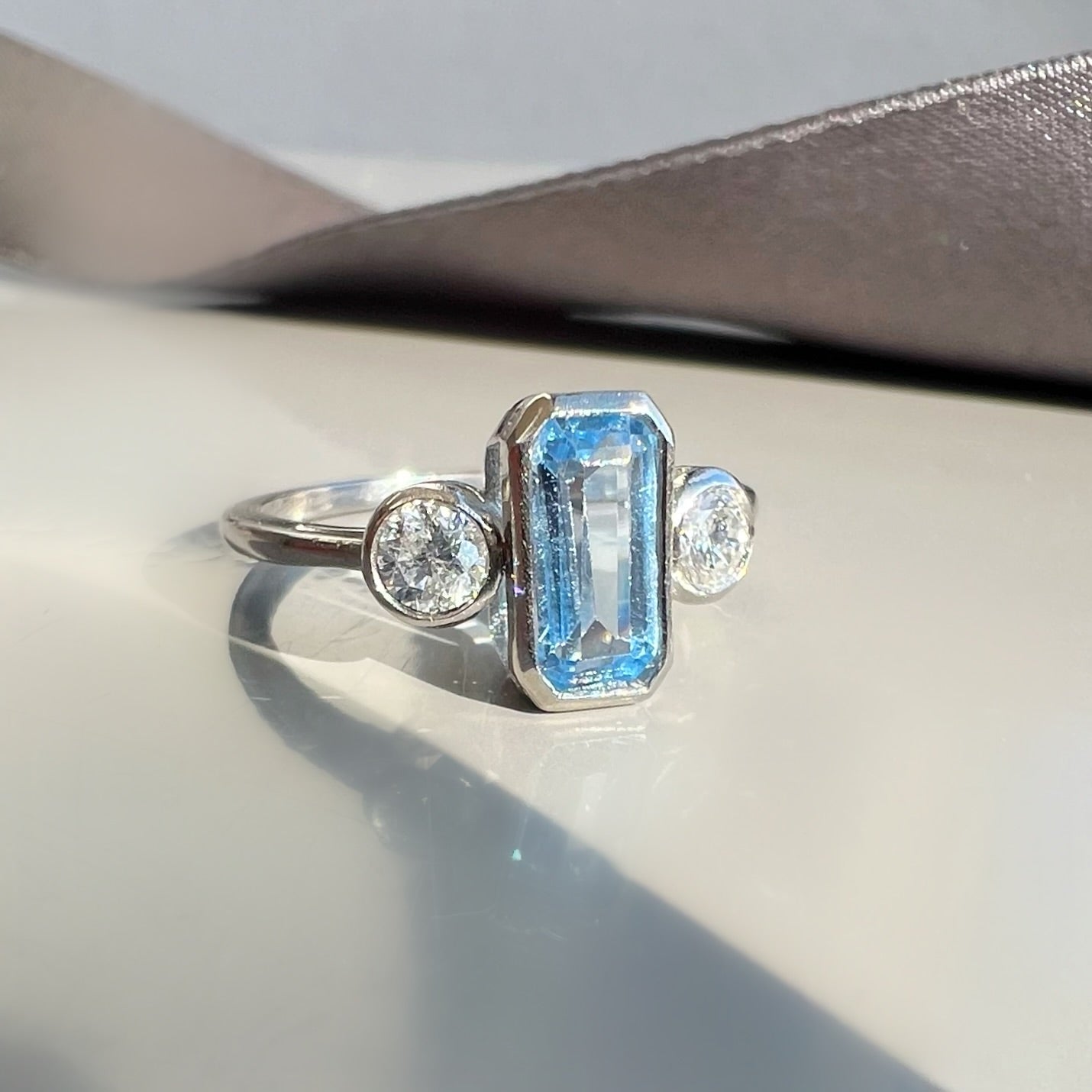 Bezel Set 0.80ct Aquamarine and 0.40ct Diamond 3 Stone ring in Platinum