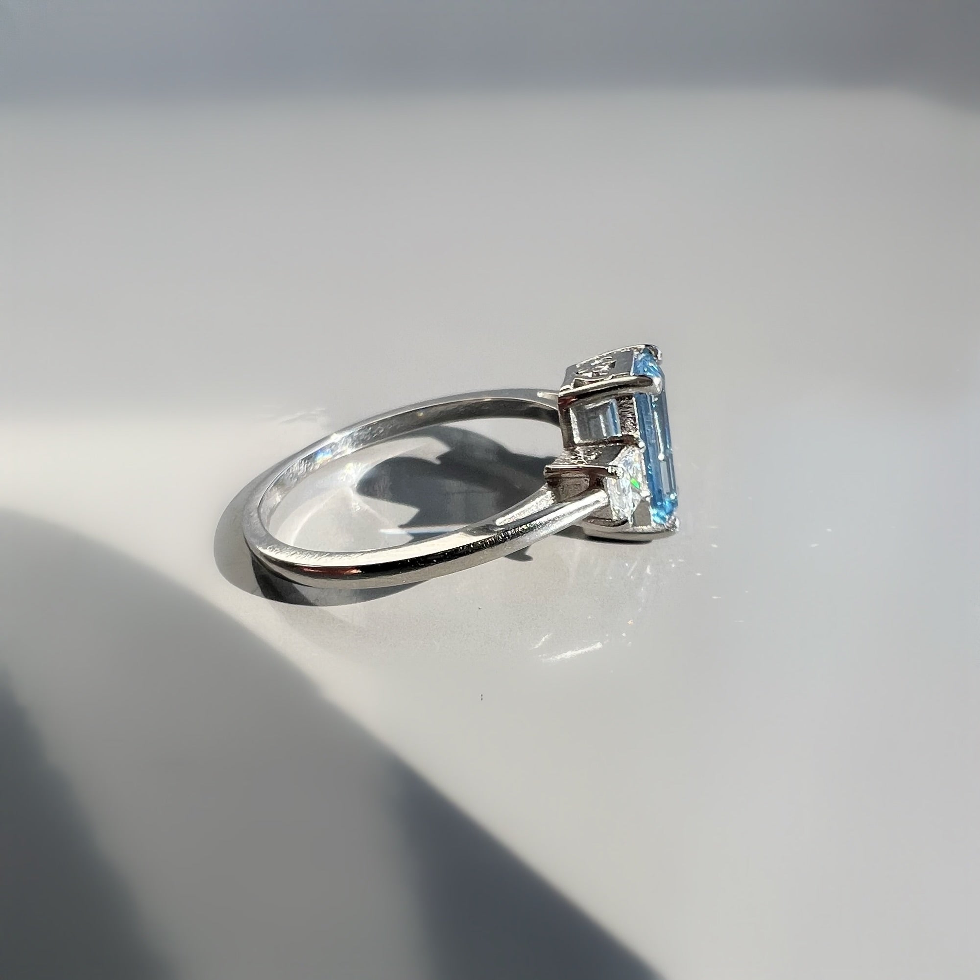 0.80ct Aquamarine and 0.26ct Princess Cut Diamond 3 Stone Ring