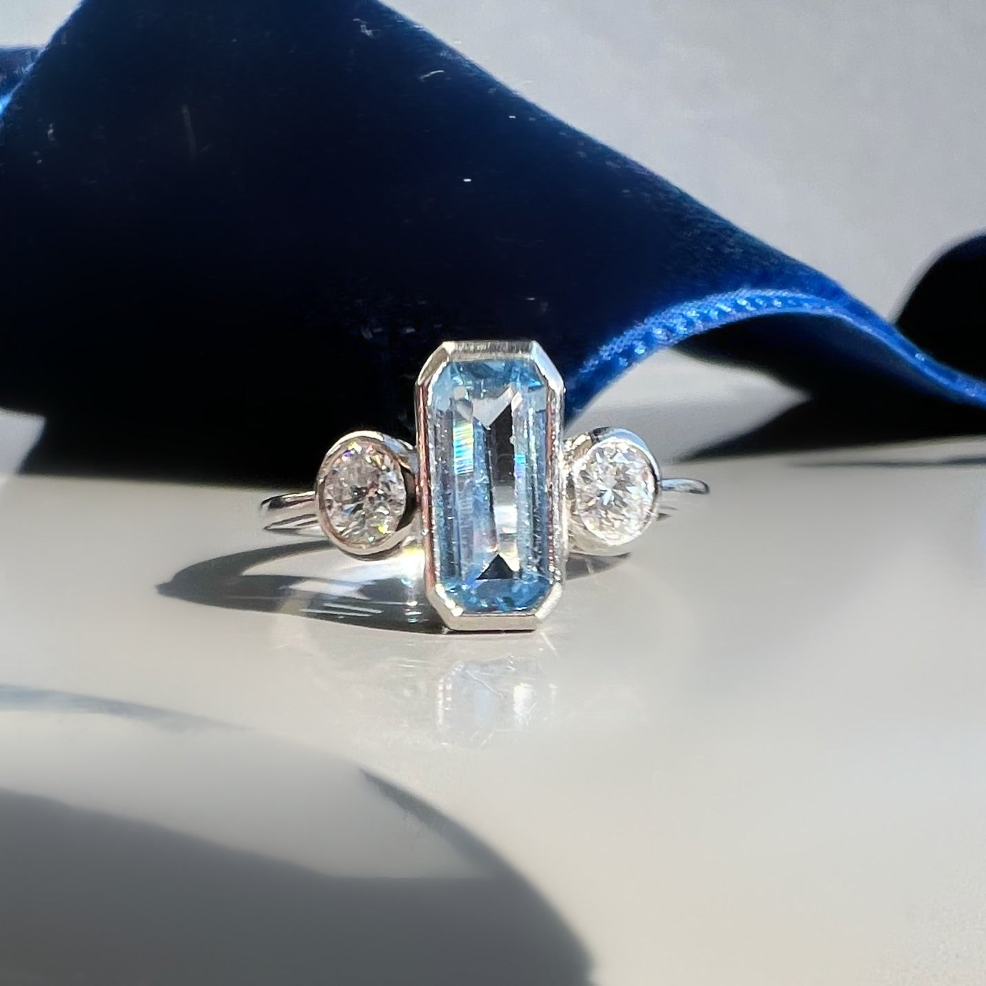 Bezel Set 0.80ct Aquamarine and 0.40ct Diamond 3 Stone ring in Platinum