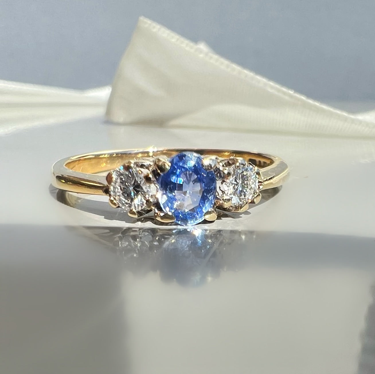 Vintage Sapphire and 0.20ct Diamond Trilogy Ring