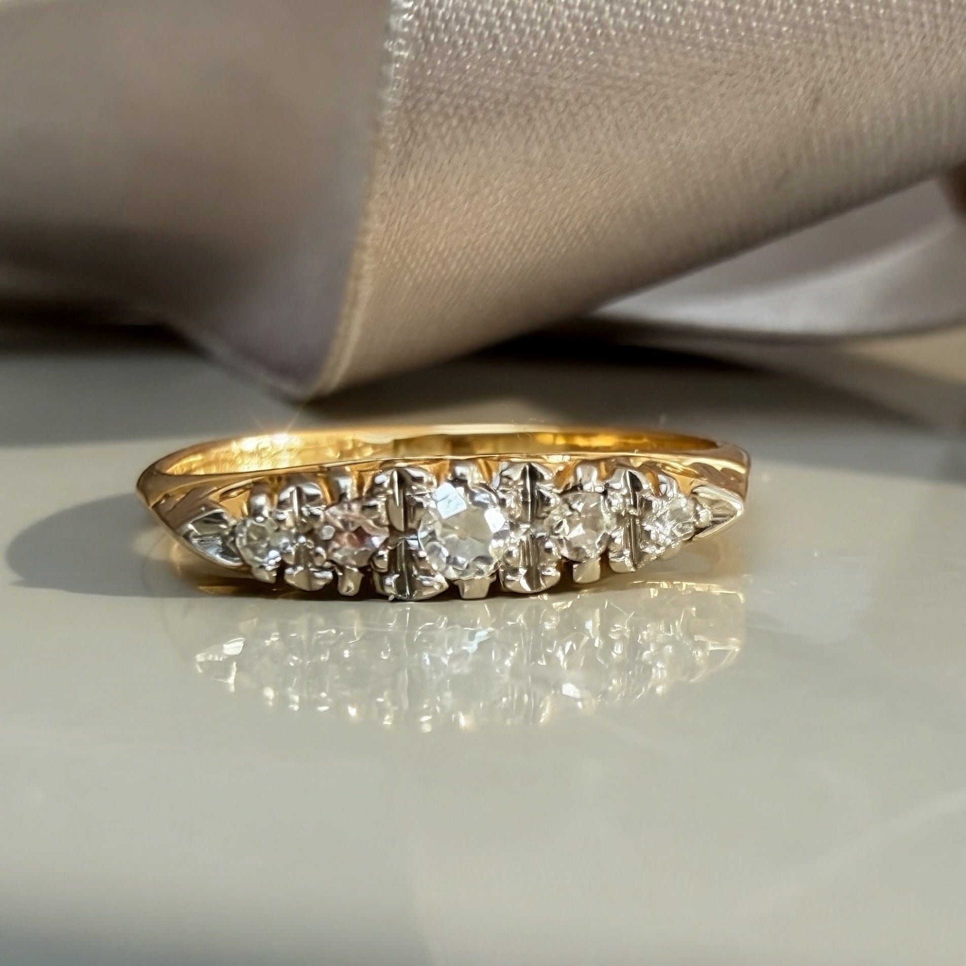 Antique Graduated 0.10ct Diamond Ring