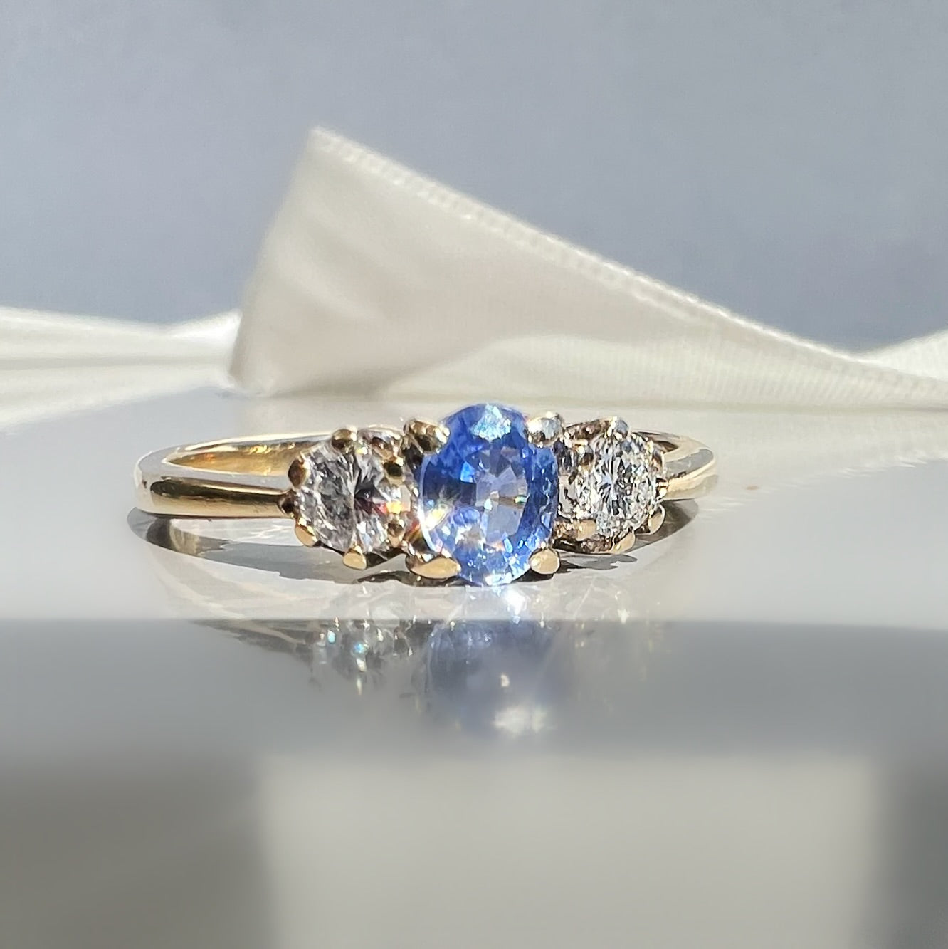 Vintage Sapphire and 0.20ct Diamond Trilogy Ring