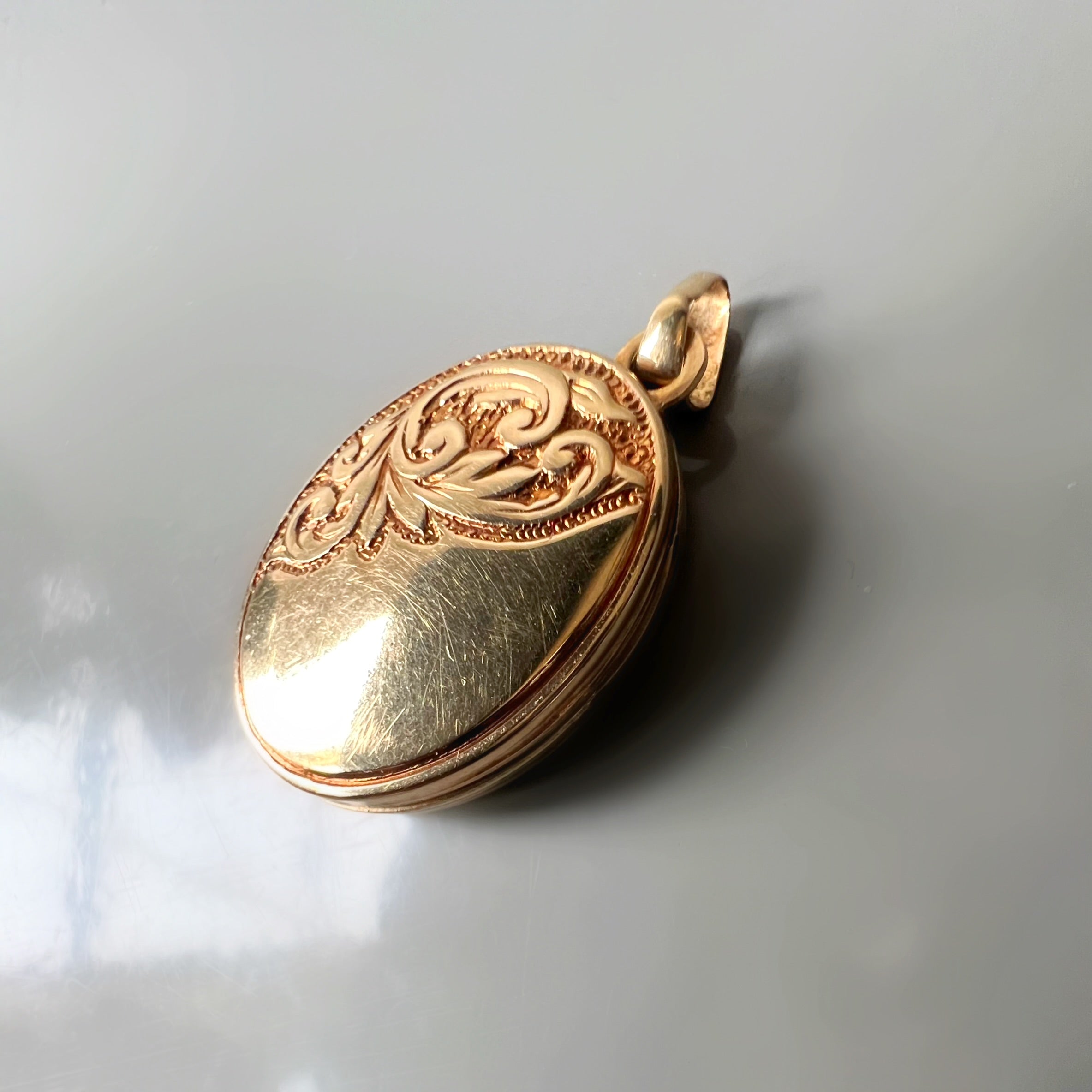 Vintage Oval Half Pattered Foliate Locket in 9ct Gold