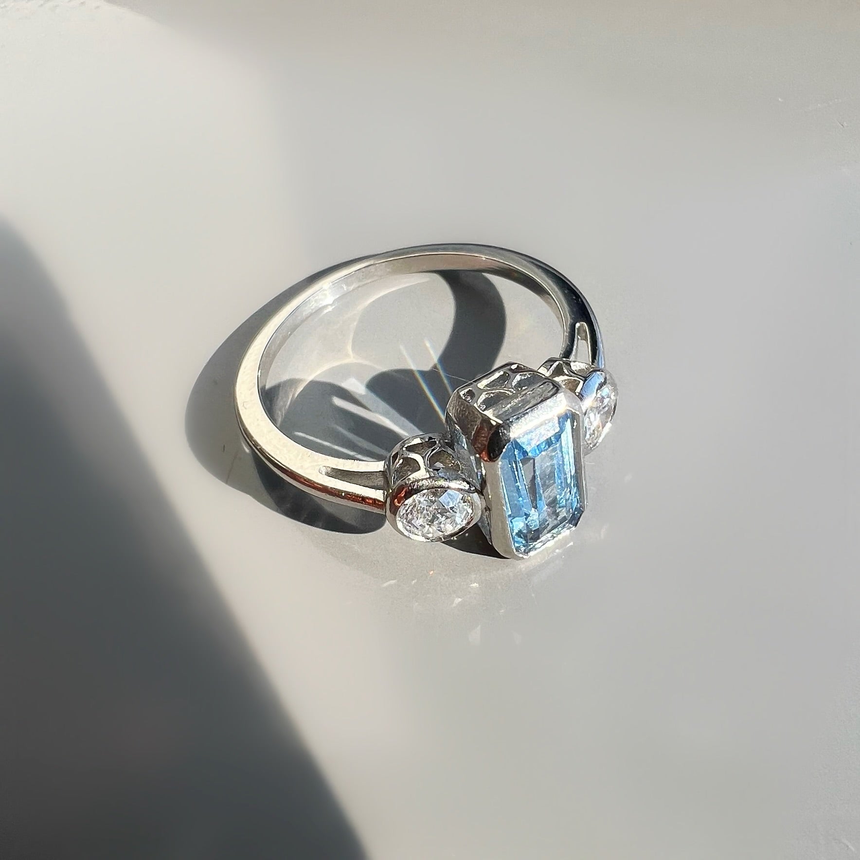 Bezel Set 0.80ct Aquamarine and 0.40ct Diamond 3 Stone ring in Platinum