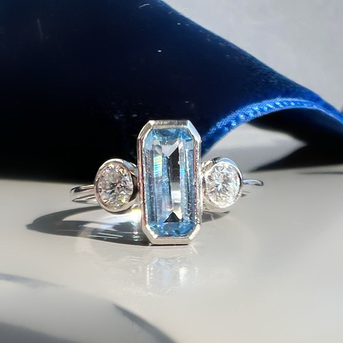 Bezel Set 0.80ct Aquamarine and 0.40ct Diamond 3 Stone ring in Platinum