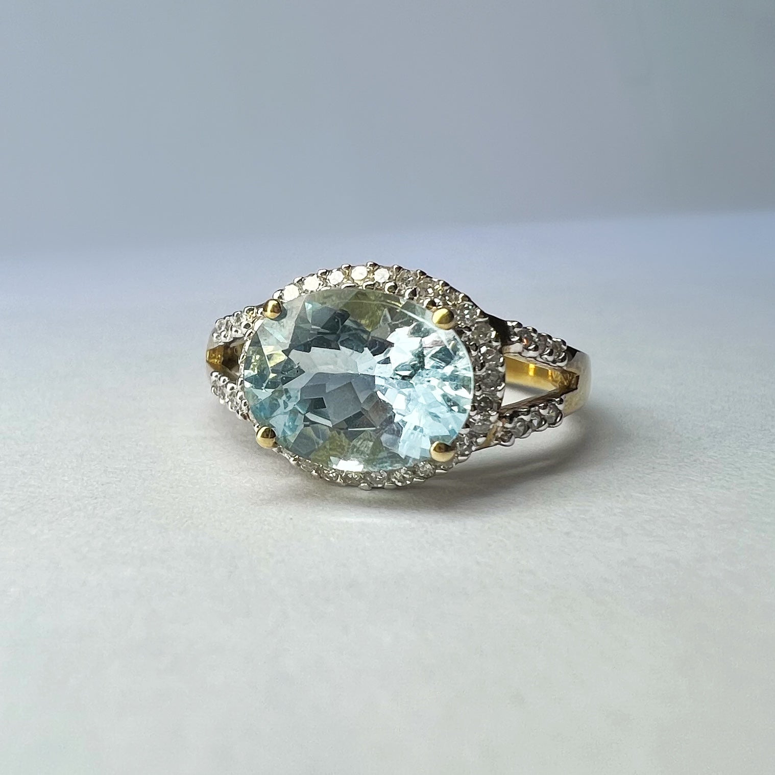 Blue Topaz and Diamond Halo Ring